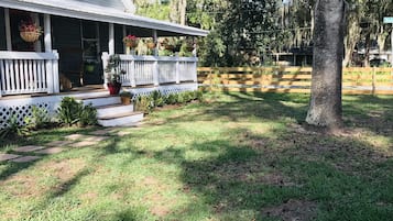 Enjoy a home away from home on this charming single-story house with a cozy front porch and beautifully manicured lawn.
