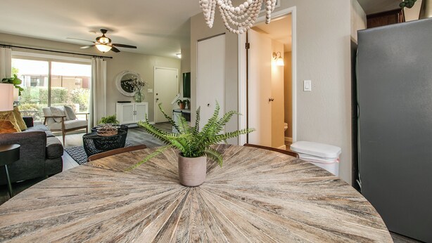 A modern kitchen with a central island, a ceiling fan, and a refrigerator. - Updated Condo in A+ Old Town Scottsdale Location! (Scottsdale)