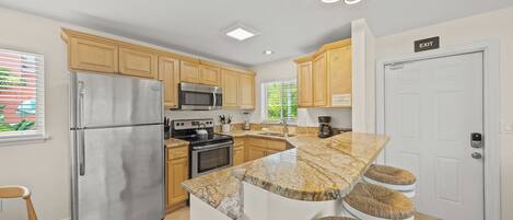 Fridge, coffee/tea maker, cookware/dishes/utensils