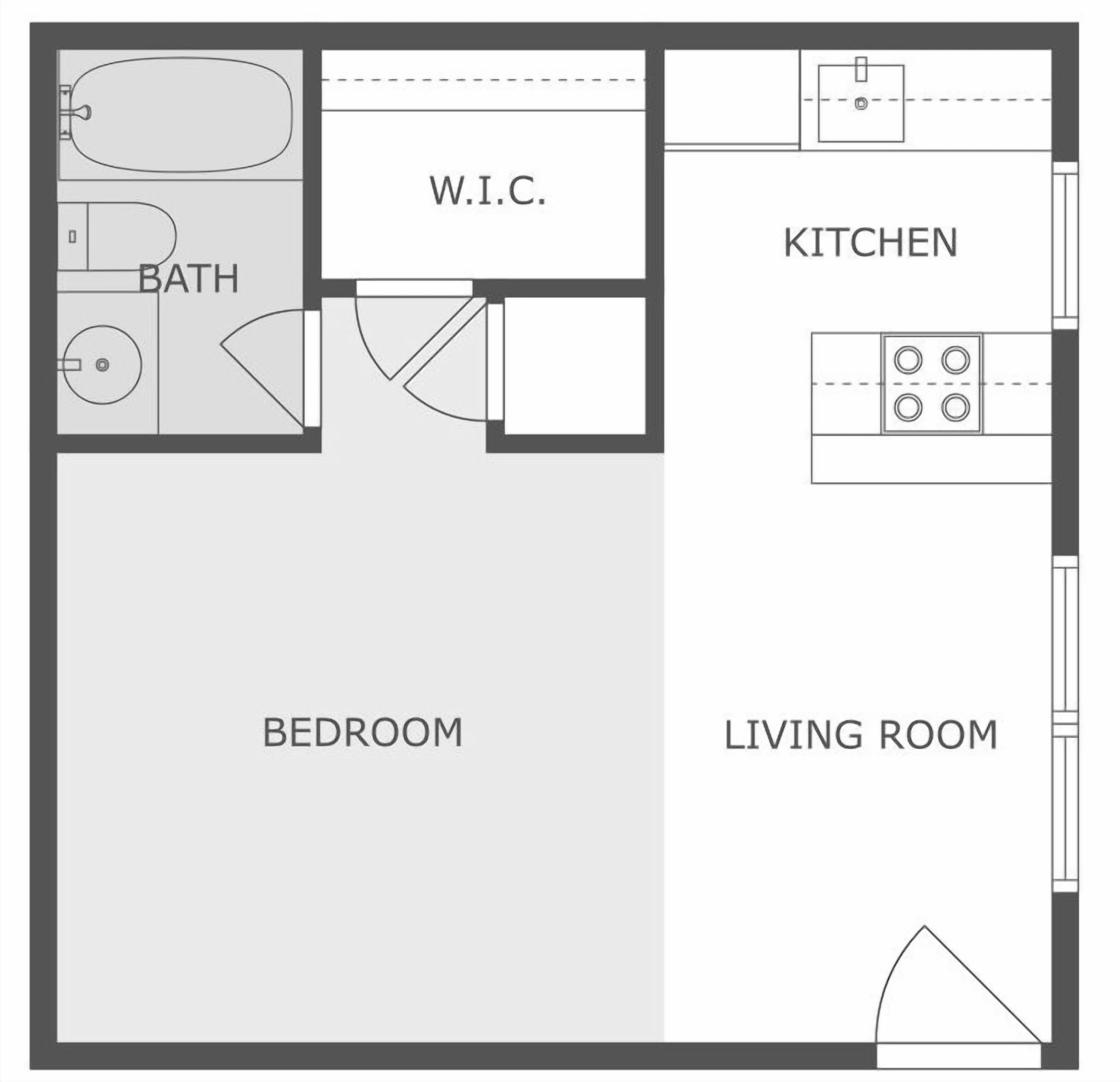 Plano de planta que muestra un dormitorio, sala de estar, cocina, baño y vestidor.