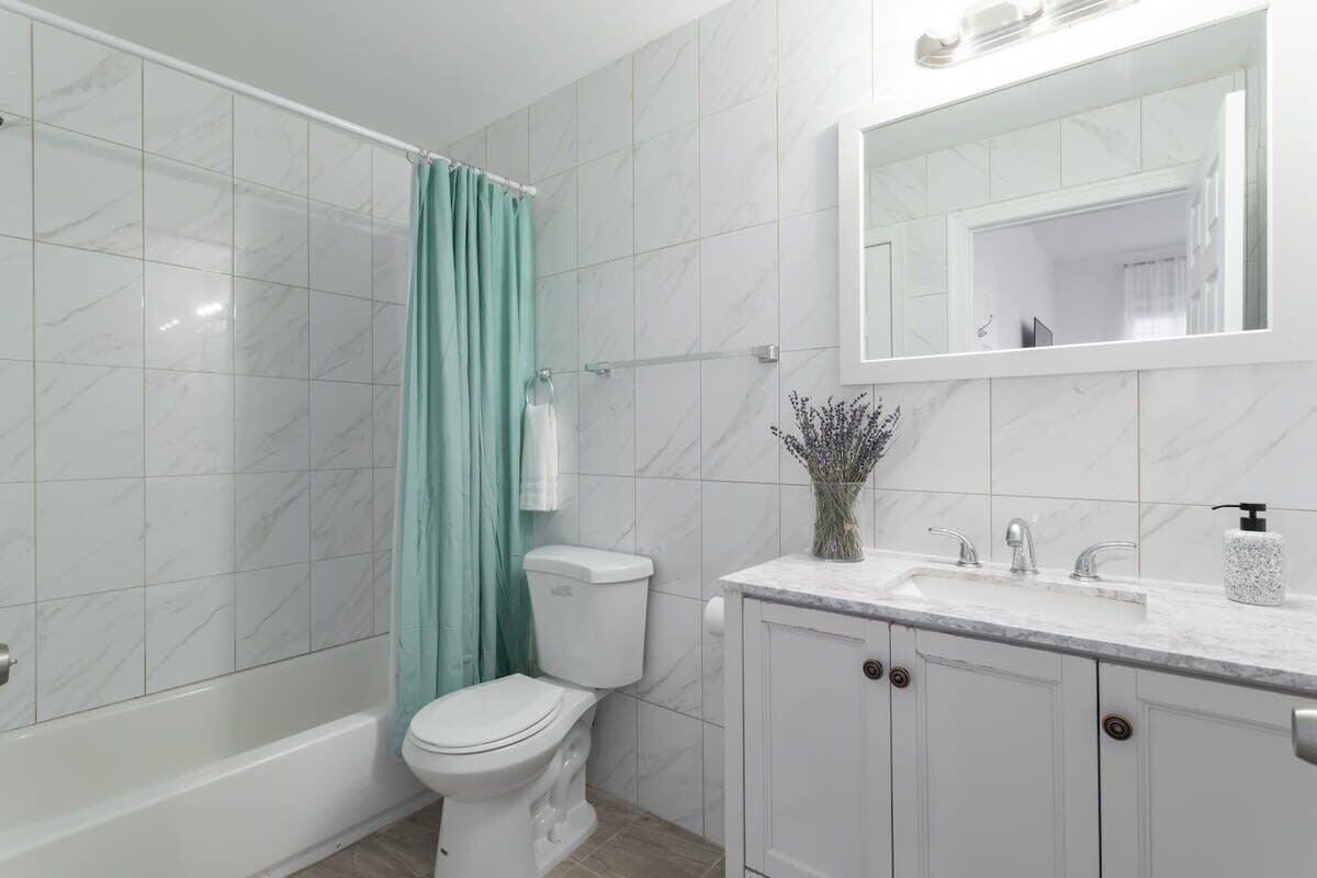 Bathtub, hair dryer, towels