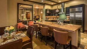 A modern kitchen with a central island, stainless steel appliances, and pendant lighting. - Welk Resorts- 2 BD NORTH VILLAGE #1 (Truckee)