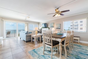 Relax in this stylish living area with a sliding glass door leading to a balcony overlooking the ocean.
