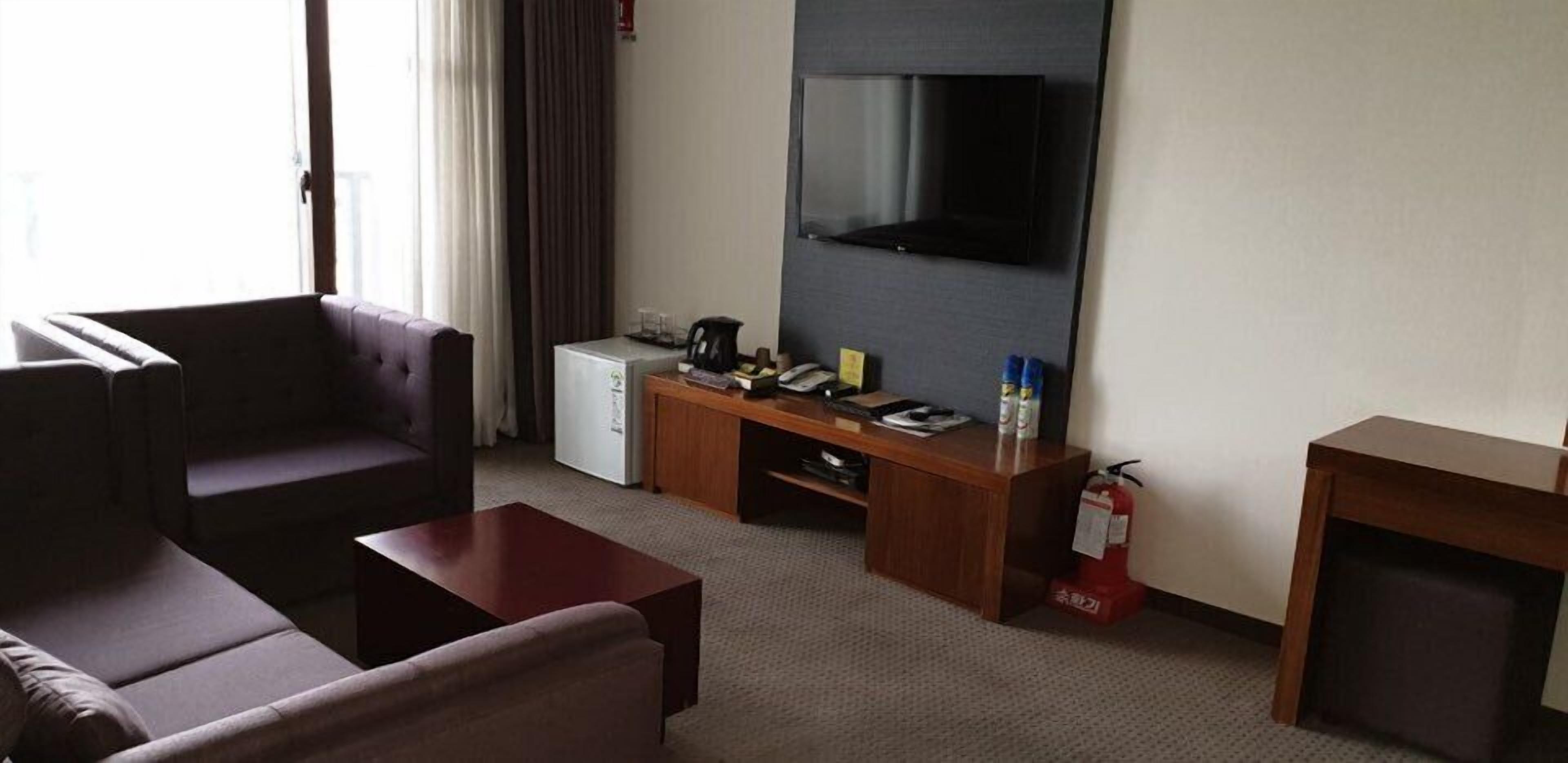 superior room | living area | flat-screen tv