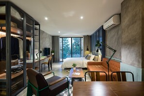 Superior Studio | Desk, laptop workspace, blackout drapes, iron/ironing board