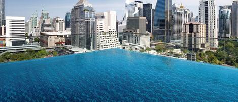 Outdoor pool, open 7:00 AM to 9:00 PM, pool umbrellas, sun loungers