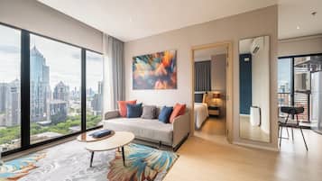 Suite, 1 Bedroom (Sky) | Living area | 49-inch LCD TV with digital channels, TV