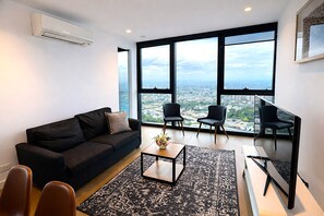 Superior Apartment, 3 Bedrooms, Non Smoking, City View | Living room - Mega Style Apartments Victoria One (Melbourne)