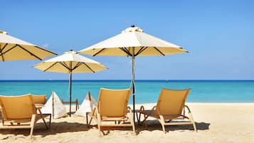 Beach nearby, white sand, beach towels