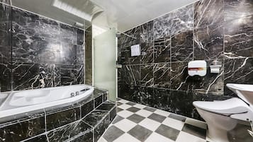 Deluxe Double Room, Smoking | Bathroom | Combined shower/tub, deep soaking tub, free toiletries, hair dryer