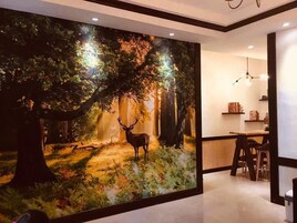 Family Quadruple Room | Living area | Flat-screen TV