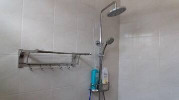 Shower, hair dryer, towels, shampoo