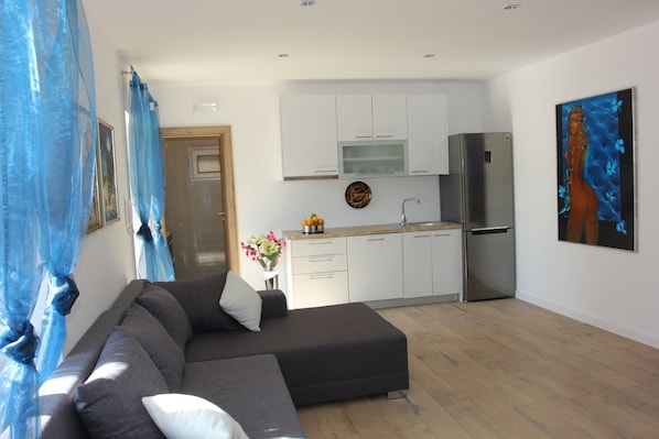Comfort Apartment, 2 Bedrooms | Living area | Flat-screen TV