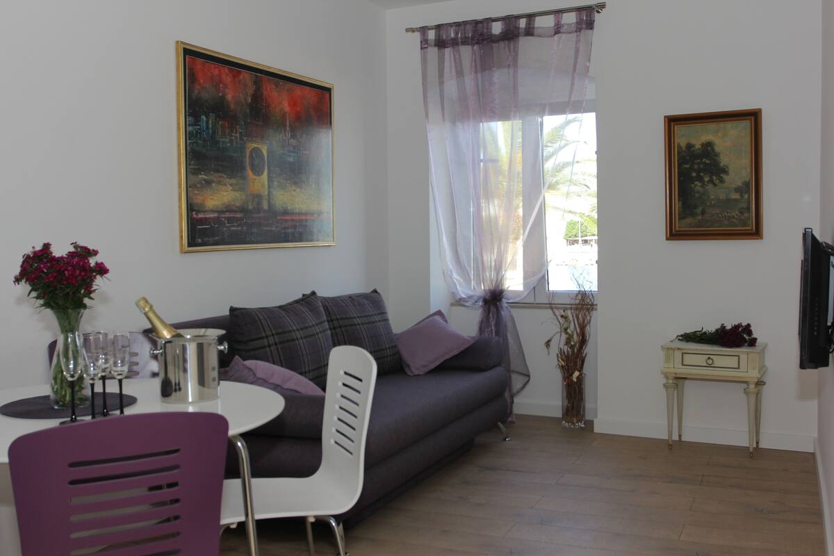 Exclusive Apartment, Sea View | Living area | Flat-screen TV