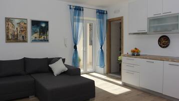 Comfort Apartment, 2 Bedrooms | Living area | Flat-screen TV