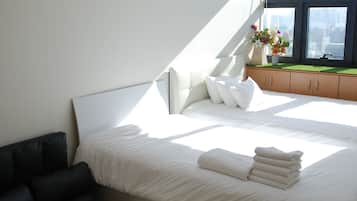 Premium bedding, desk, laptop workspace, iron/ironing board