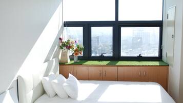 Premium bedding, desk, laptop workspace, iron/ironing board