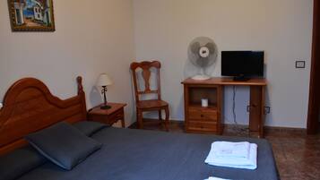 Desk, laptop workspace, blackout drapes, iron/ironing board