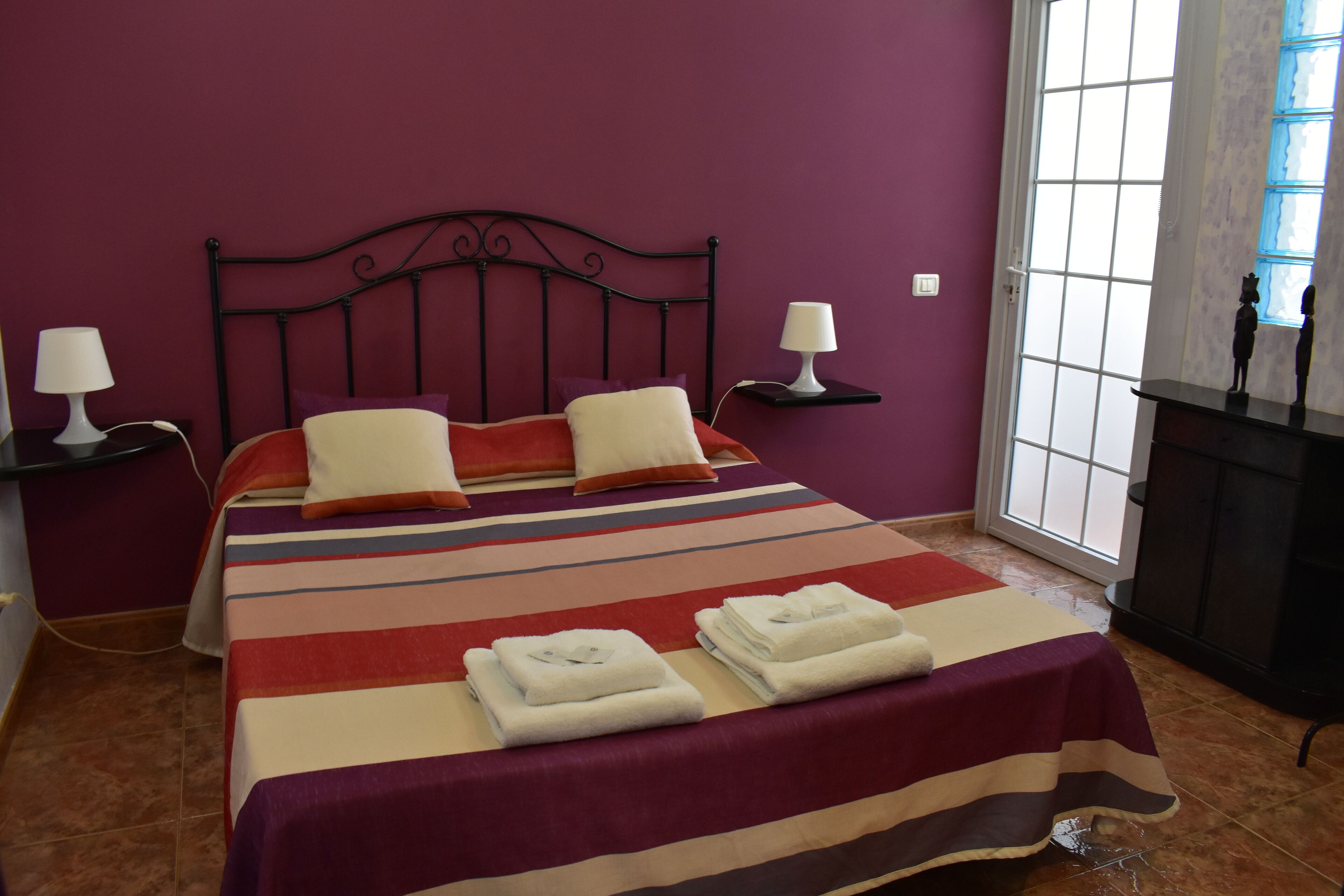 Desk, laptop workspace, blackout drapes, iron/ironing board