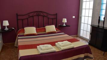 Desk, laptop workspace, blackout drapes, iron/ironing board