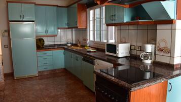 Desk, laptop workspace, blackout drapes, iron/ironing board