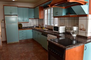 Desk, laptop workspace, blackout drapes, iron/ironing board