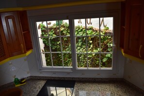 Desk, laptop workspace, blackout drapes, iron/ironing board