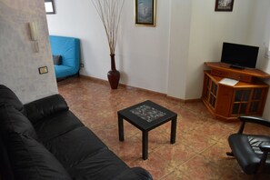 Desk, laptop workspace, blackout curtains, iron/ironing board