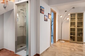 Bathtub, towels, soap, toilet paper