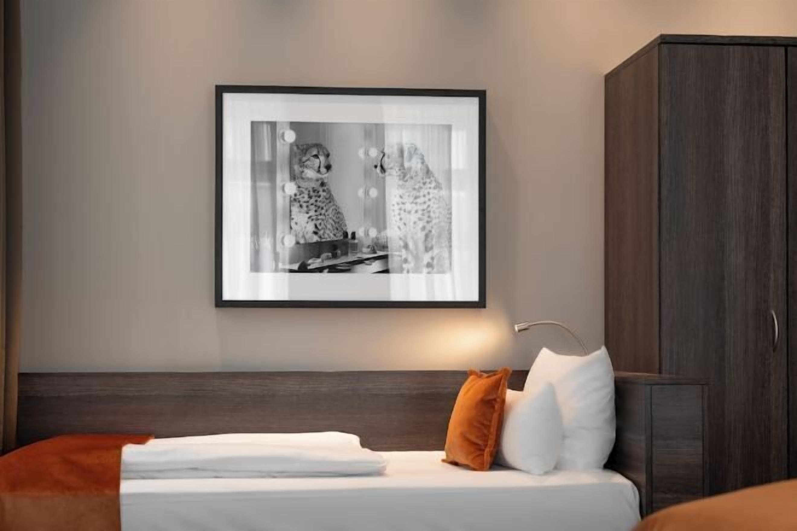 Hypo-allergenic bedding, in-room safe, laptop workspace