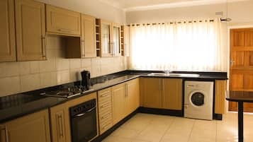 Family House | Private kitchen | Oven, cleaning supplies