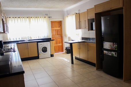 Family House | Private kitchen | Oven, cleaning supplies