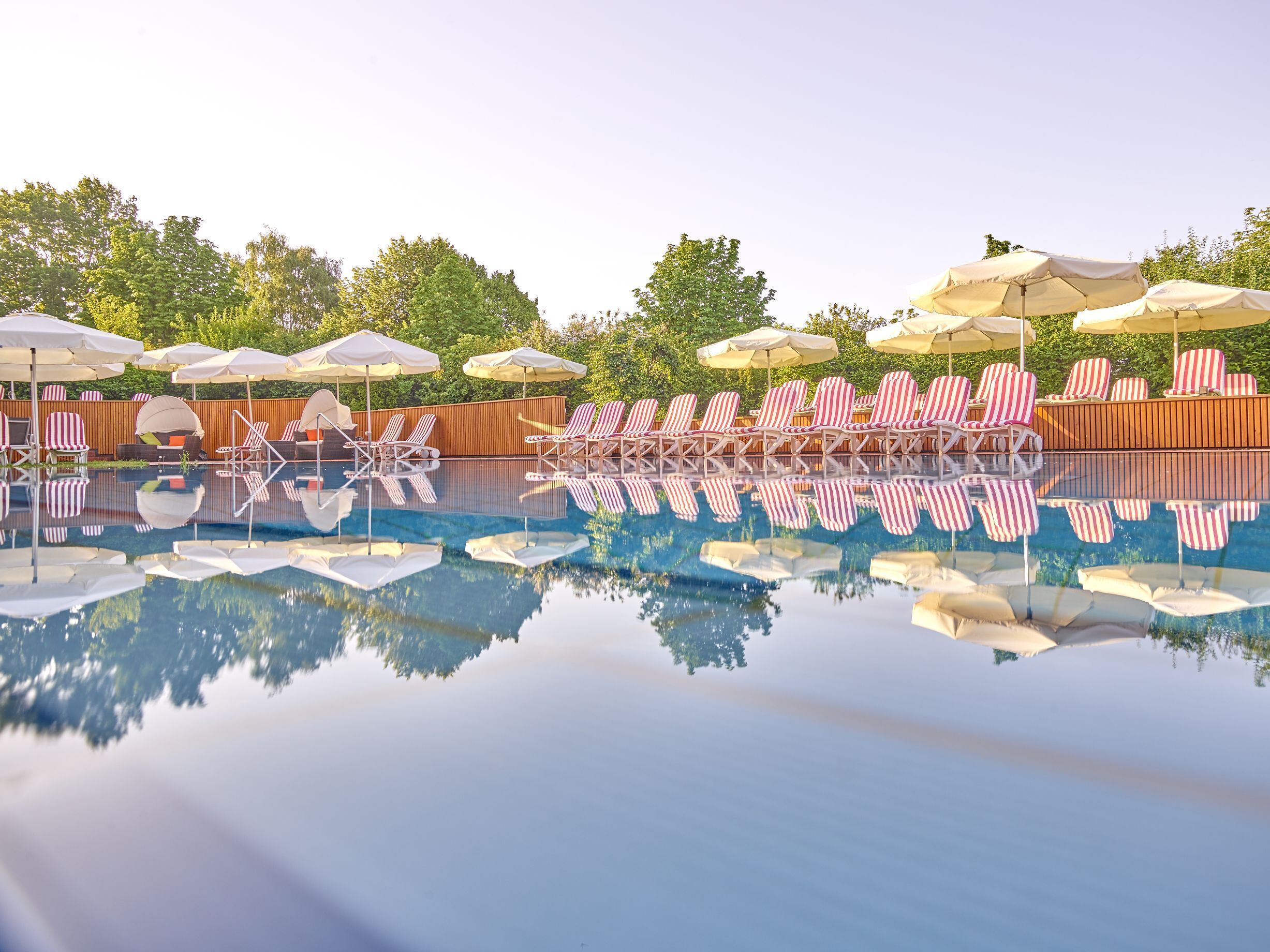 indoor pool, outdoor pool, open 7:00 am to 8:00 pm, pool umbrellas