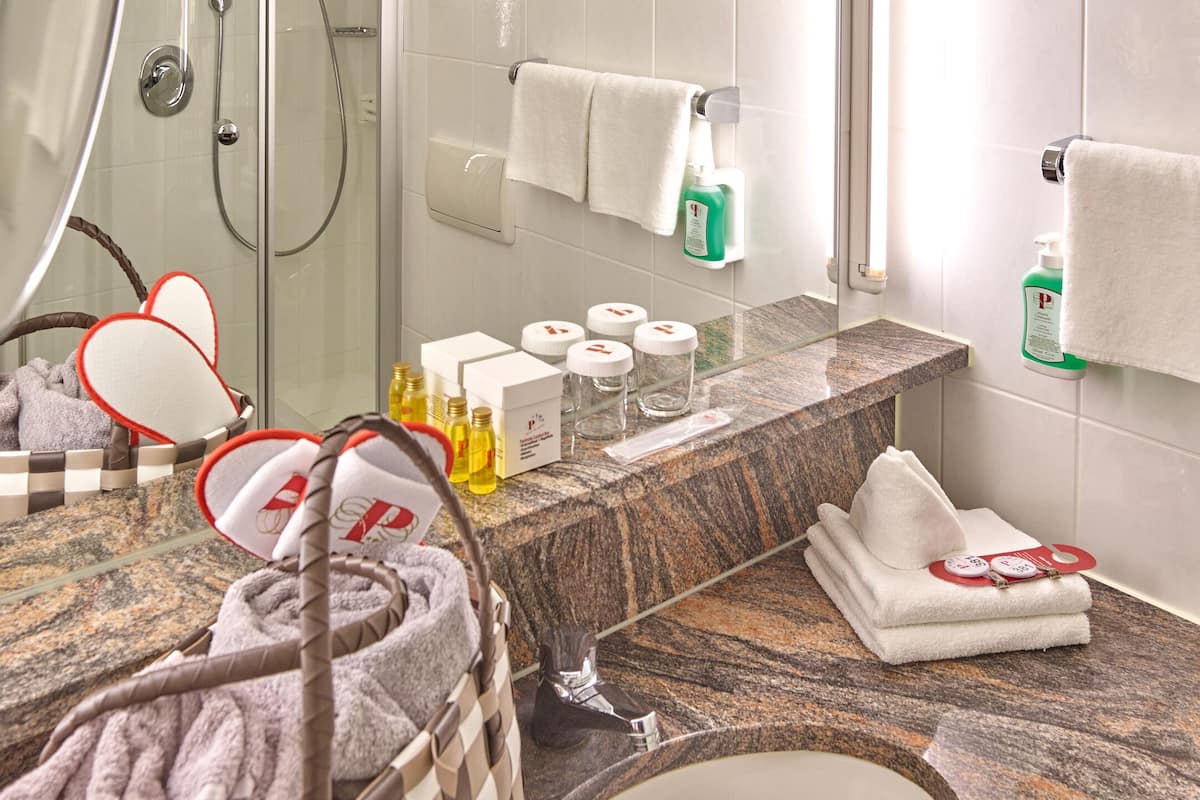 hair dryer, bathrobes, slippers, towels