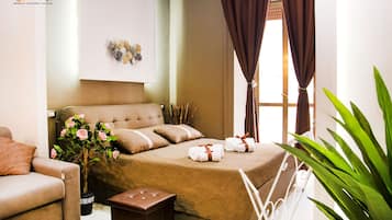 Deluxe Quadruple Room, Balcony, City View (Hug) | Free WiFi, bed sheets