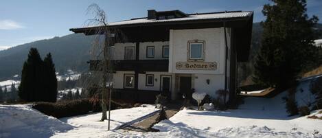 A two-story building with a sign reading 'Bodner.'