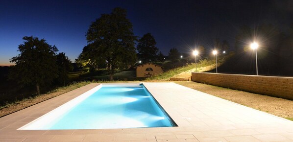 Seasonal outdoor pool, open 9:00 AM to 7:00 PM, pool umbrellas
