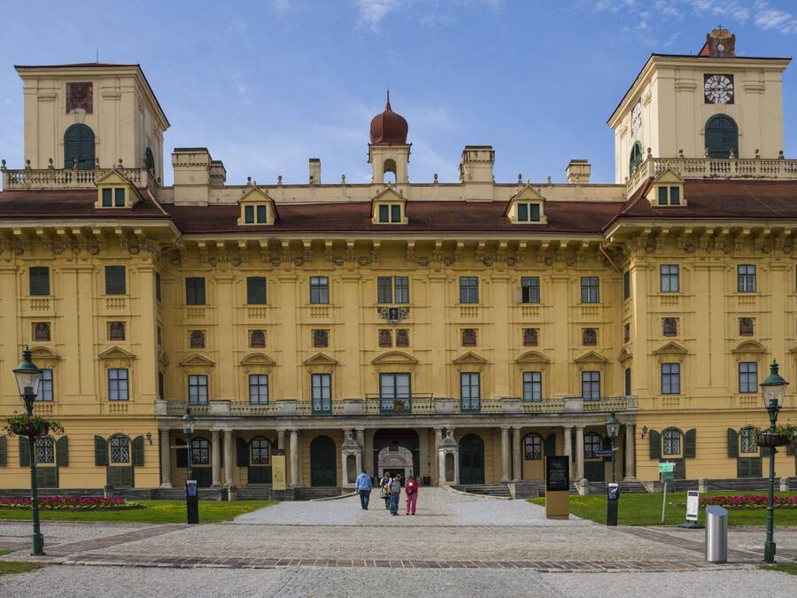 A large, historic building with a symmetrical facade, multiple windows, and a central entrance.