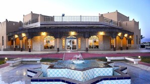 A large building with a central courtyard, a fountain, and a balcony. - Samharam Resort Salalah (Salalah)