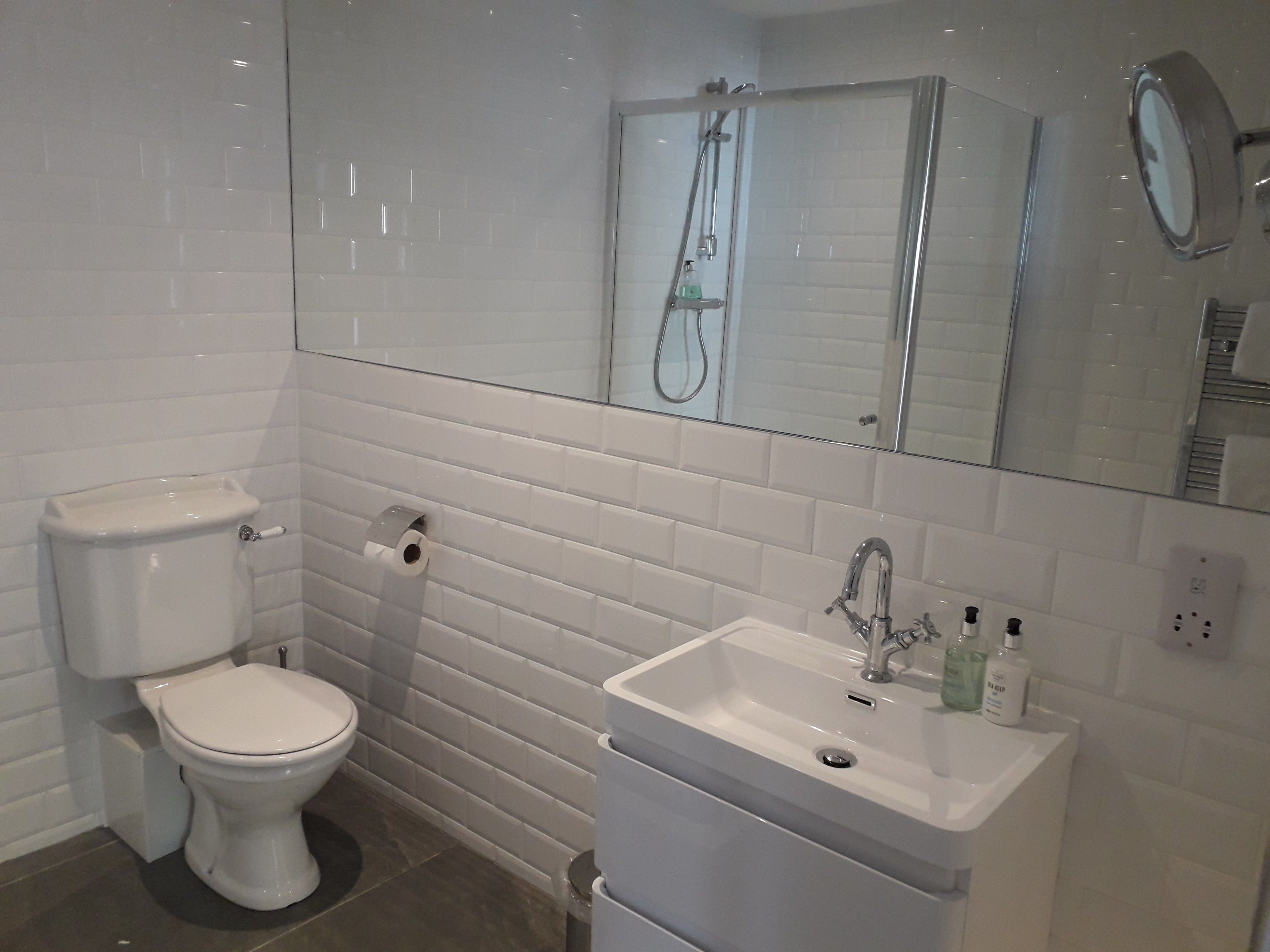 standard quadruple room | bathroom | shower, hair dryer, towels, soap