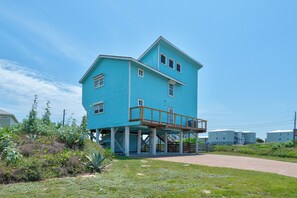 A two-story building with a balcony on the upper floor.