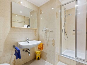 A bathroom with a sink, mirror, shower, and toilet. - Spacious Apartment in Saalbach-hinterglemm near Ski Area (Saalbach-Hinterglemm)