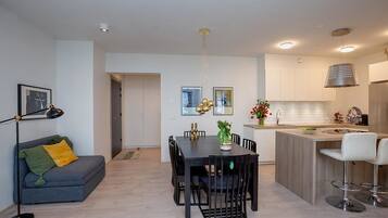 Deluxe Apartment, 2 Bedrooms | Living area | Smart TV