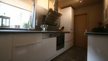 Apartment | Private kitchen | Full-sized fridge, oven, stovetop, dishwasher