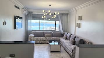 Panoramic Apartment | Living room | 55-inch Smart TV with satellite channels, TV, first-run films