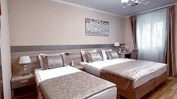 Basic Triple Room (Run of the House) | In-room safe, desk, laptop workspace, blackout drapes