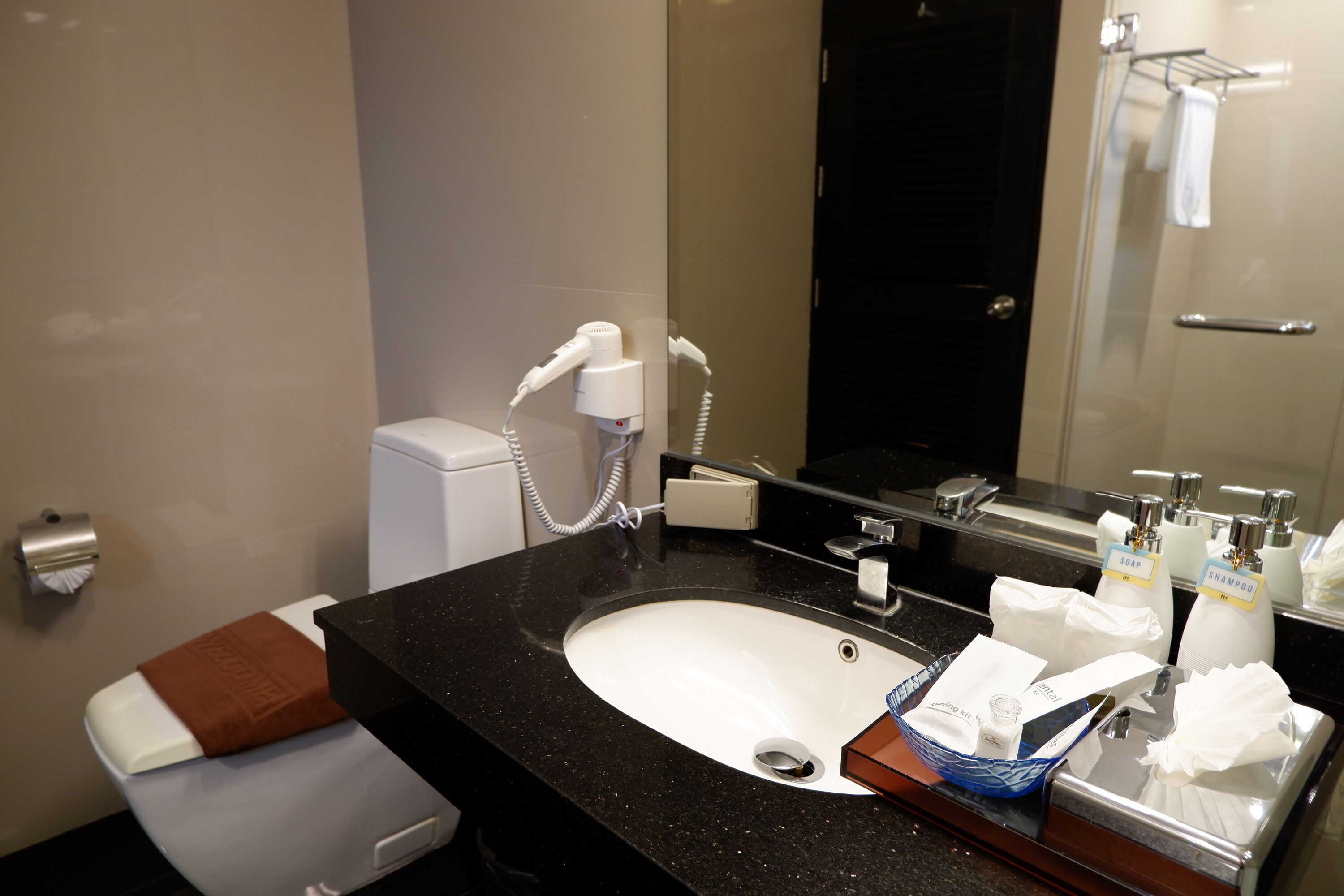 one bedroom suite with pool view | bathroom sink