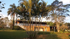 A two-story building with a white staircase leading to the upper level.