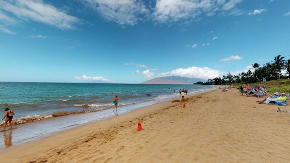 Guests can enjoy a serene beach experience with calm seas and clear skies.