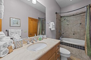 A bathroom with a sink, toilet, and bathtub. - Large Mountain Condo in Gated Golf Resort, Washer & Dryer, Golf Course View!  (Whittier)